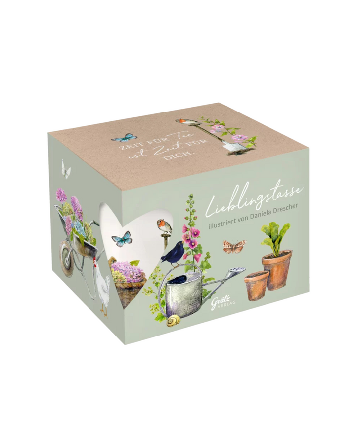 Geschenkverpackung der Garten Lieblingstasse vom Grätz Verlag vor weißem Hintergrund.
