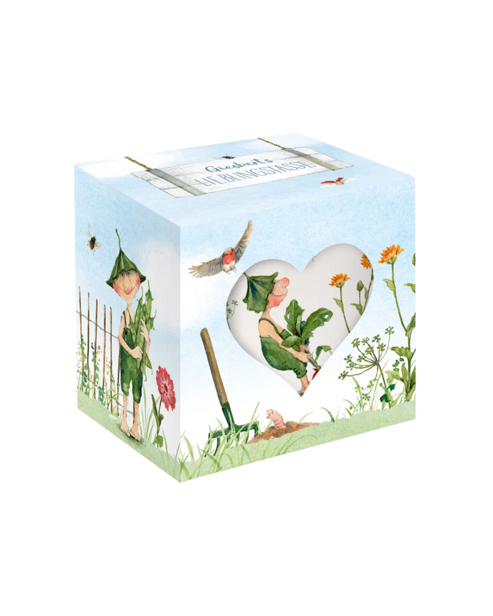 Geschenkverpackung mit der Giesbert Lieblingstasse vom Grätz Verlag vor weißem Hintergrund.