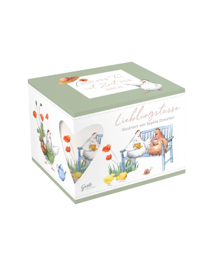 Geschenkverpackung mit der Hühnerbanden Lieblingstasse vom Grätz Verlag vor weißem Hintergrund.
