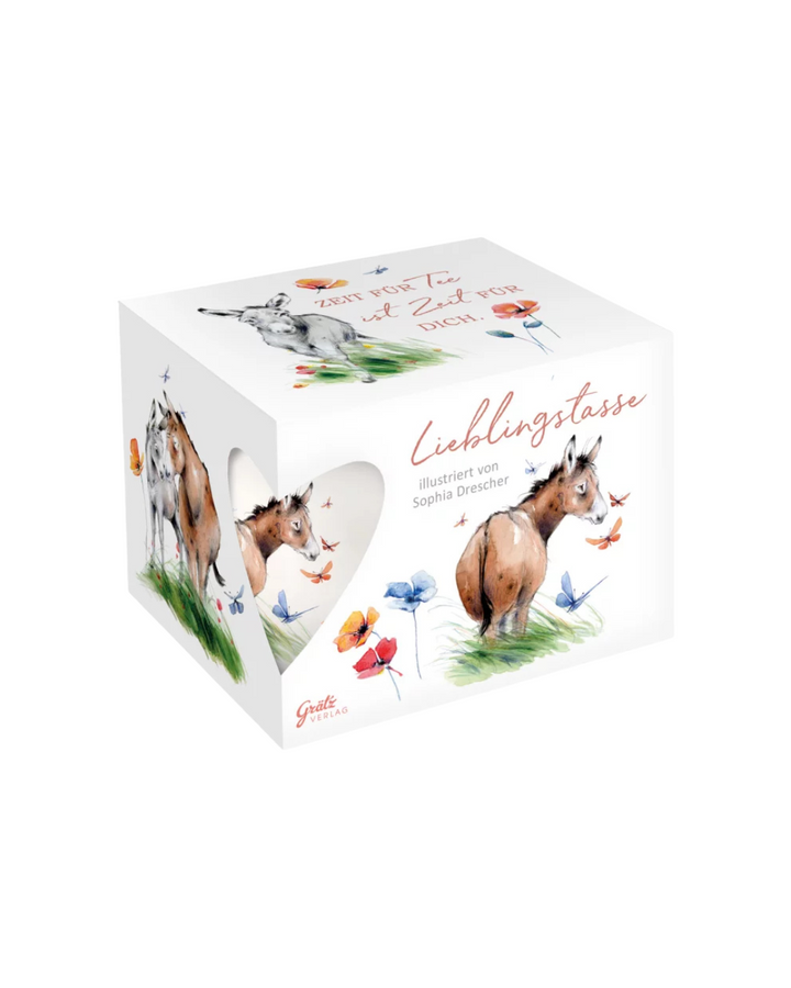 Geschenkverpackung der Kuschelfreunde Lieblingstasse vom Grätz Verlag vor weißem Hintergrund. Auf dem Deckel steht: Zeit für Tee ist Zeit für dich.