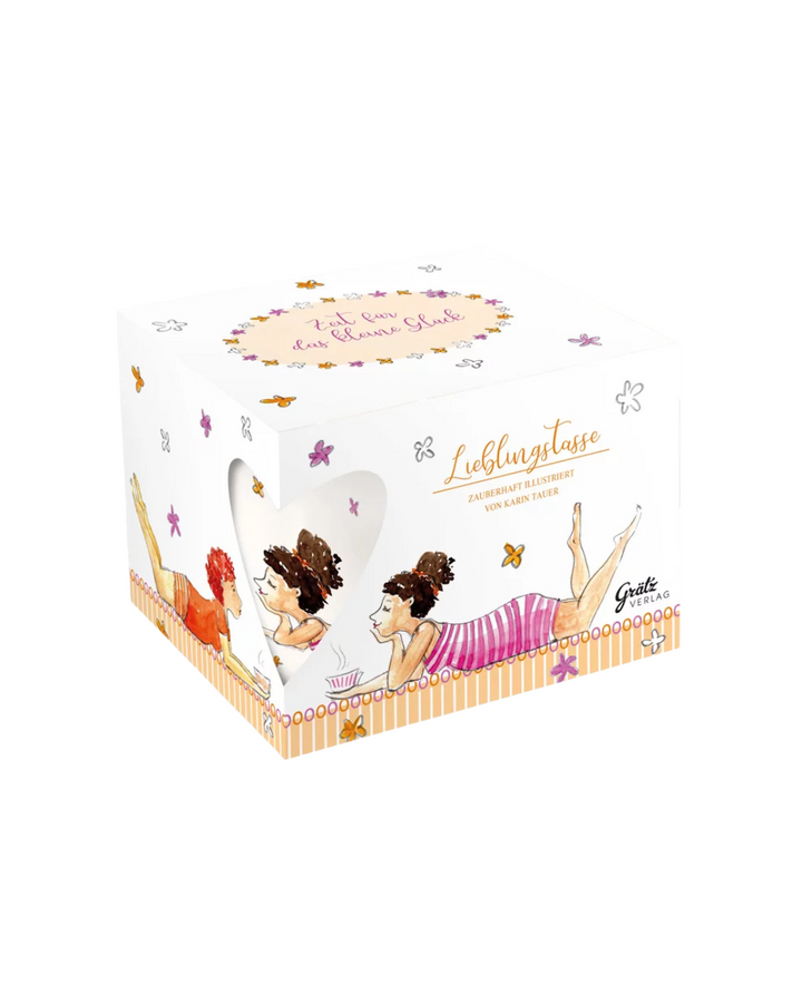 Geschenkverpackung mit der Lebenslust Lieblingstasse vom Grätz Verlag vor weißem Hintergrund. Auf dem Deckel steht: Zeit für das kleine Glück.