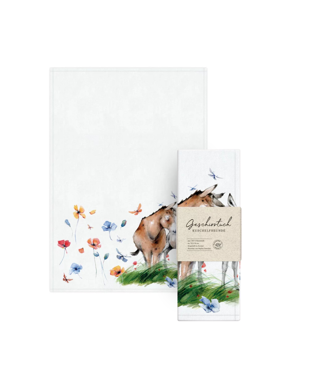 Geschirrtuch „Kuschelfreunde“ vom Grätz Verlag zusammen mit der Verpackung. Das Motiv zeigt zwei sich zärtlich anlehnende Esel, die von einer bunten Sommerwiese mit Blumen und Schmetterlingen umgeben sind.