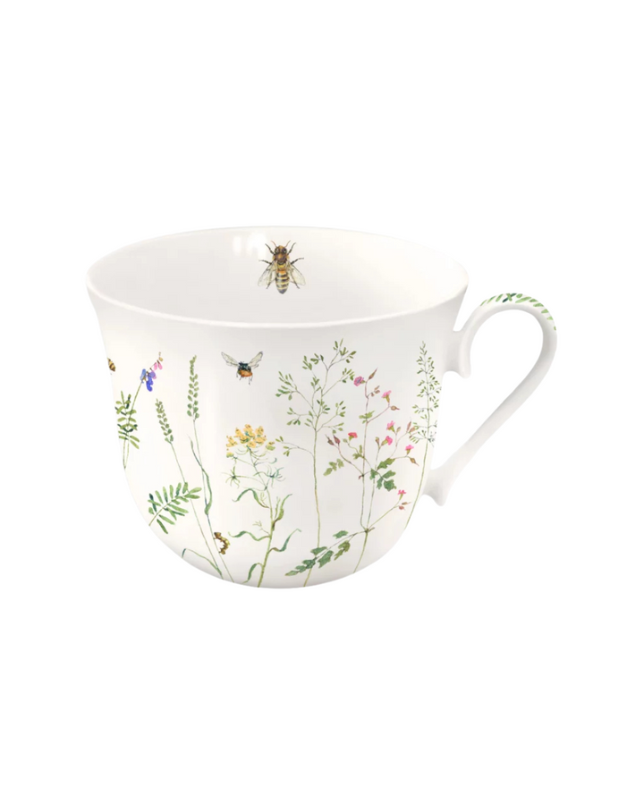 Hier ist deine neue Lieblingstasse mit Bienen und Blumen Motiv vom Grätz Verlag illustriert von Daniela Drescher vor einem weißen Hintergrund.