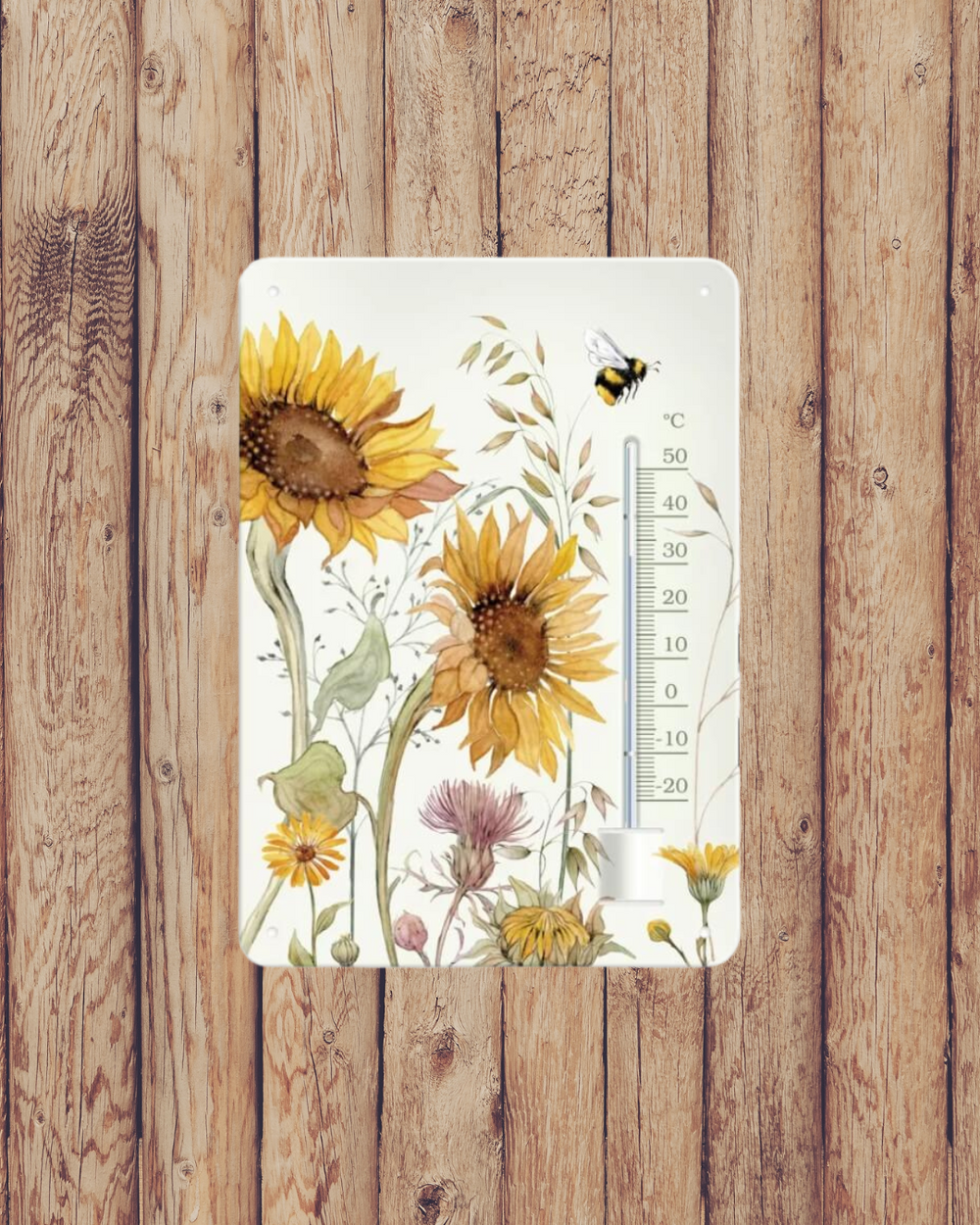 Sonnenblumen Thermometer vom Grätz Verlag mit einem Motiv von Daniela Drescher an einer Holzwand.