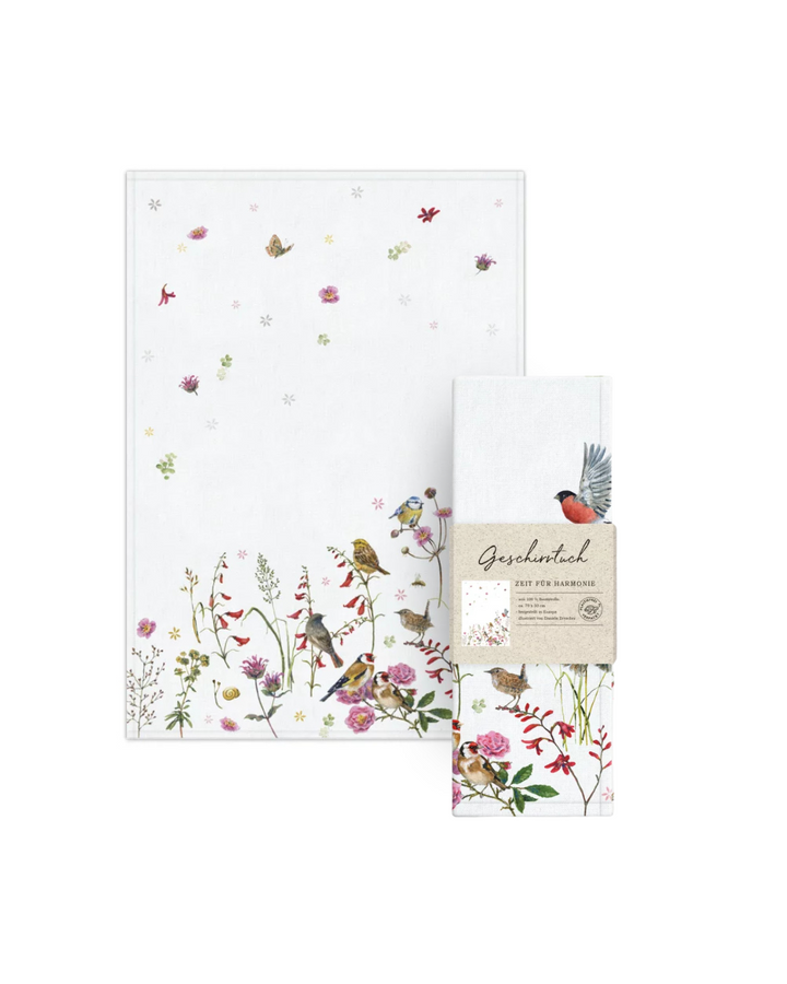 Geschirrtuch Zeit für Harmonie mit Verpackung vom Grätz Verlag – Naturmotiv von Daniela Drescher mit Singvögeln und Blumenwiese.