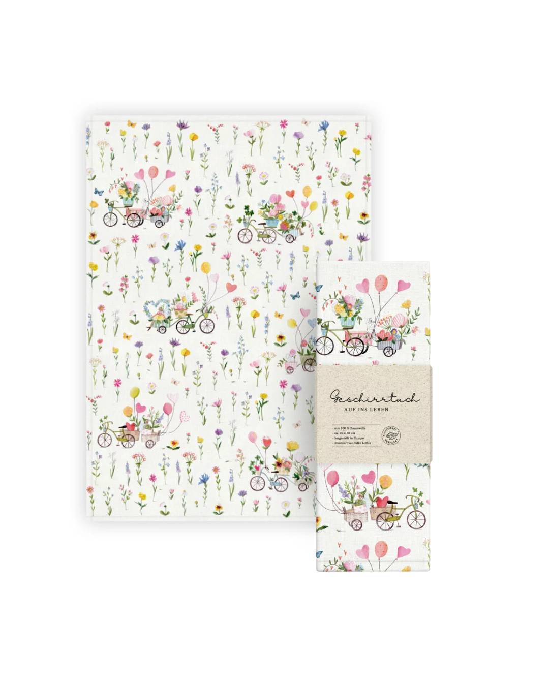 Geschirrtuch „Auf ins Glück“ vom Grätz Verlag mit floralen Mustern und kleinen Fahrrädern auf hellem Hintergrund, gestaltet von Silke Leffler.