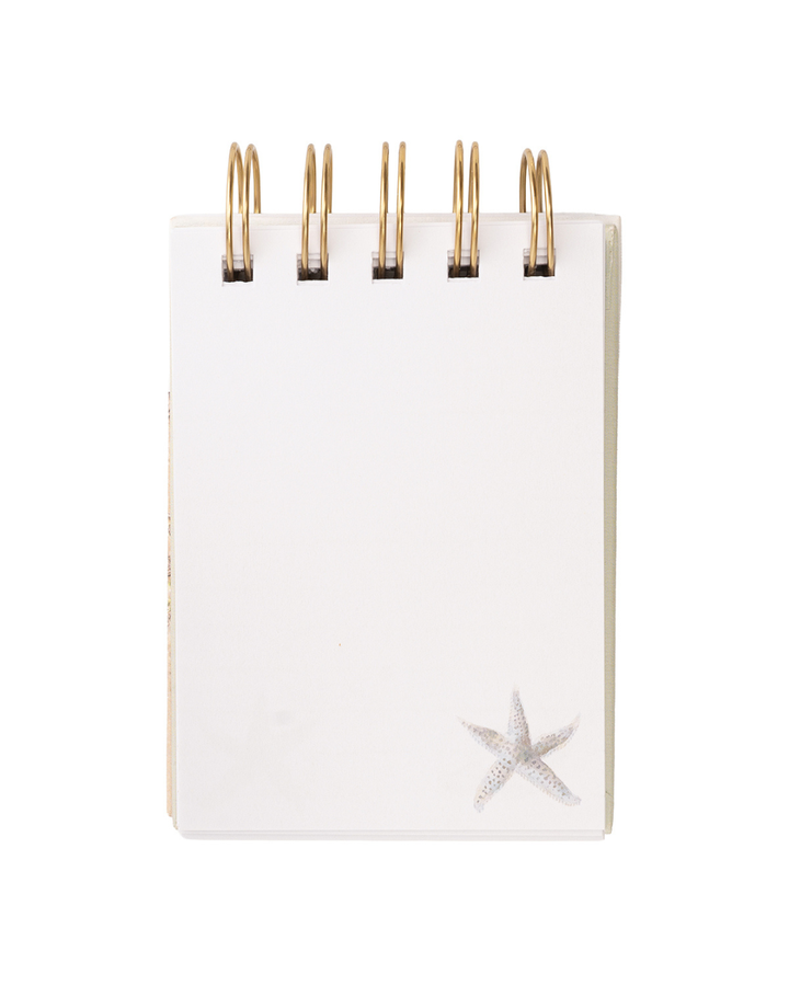 Blanco Seite im Mini Notiz- und Skizzenbuch „Seaside“ von Wrendale Designs mit kleiner Seestern-Illustration unten rechts.