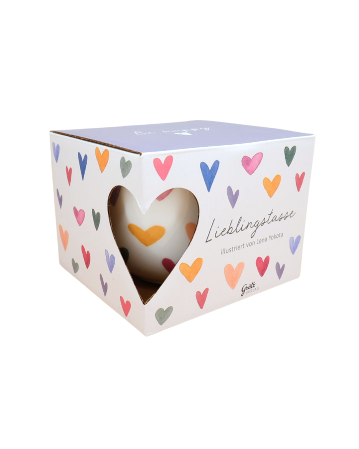 Geschenkverpackung der Lieblingstasse Von Herzen mit Herzausschnitt und bunten Herzen der Marke Grätz Verlag, isoliert auf weißem Hintergrund.