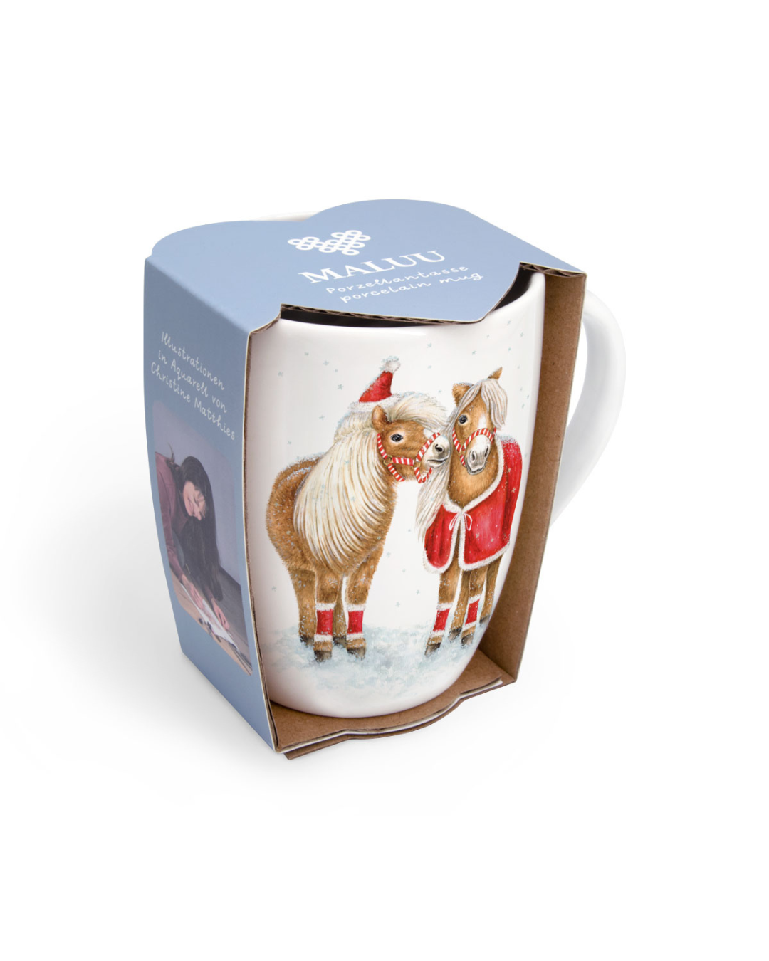 Maluu Weihnachtstasse Jolly Ponies in der hellblauen Geschenkverpackung, vorne sichtbar mit zwei fröhlichen Ponys im Schnee, festliches Wintermotiv.
