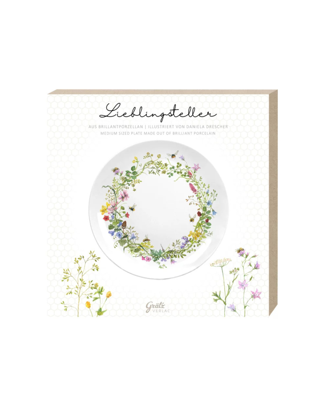 Geschenkverpackung des Frühstückstellers Wilde Bienen mit floralen Motiven und Illustrationen von Daniela Drescher vor weißem Hintergrund.