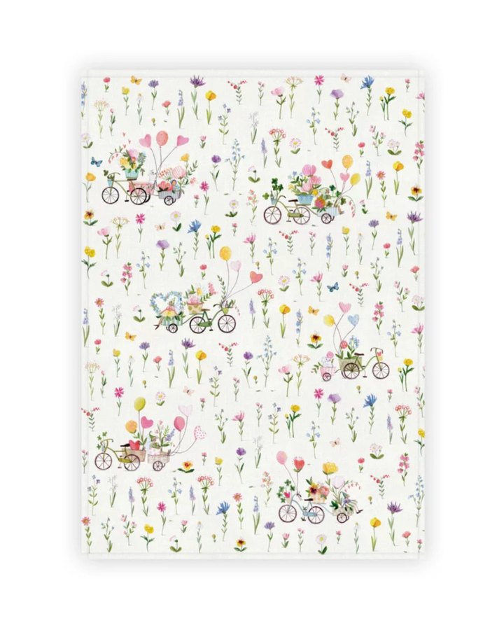 Ausgebreitetes Geschirrtuch „Auf ins Glück“ vom Grätz Verlag mit detailreichen Blumenillustrationen und verspielten Fahrradmotiven.