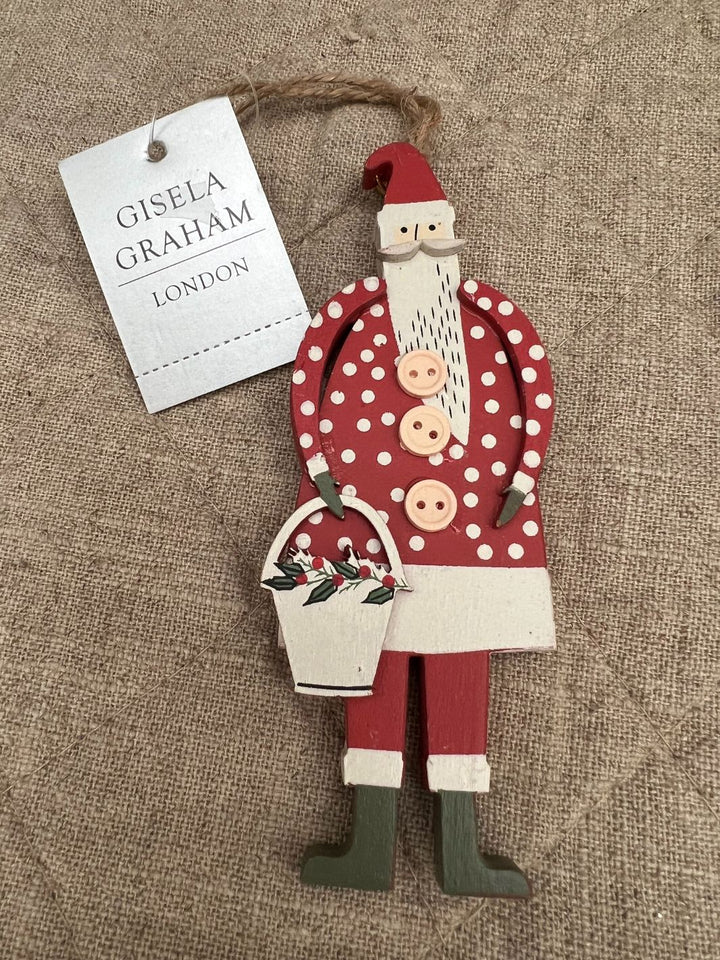 Roter Holznikolaus mit weißen Punkten von Gisela Graham