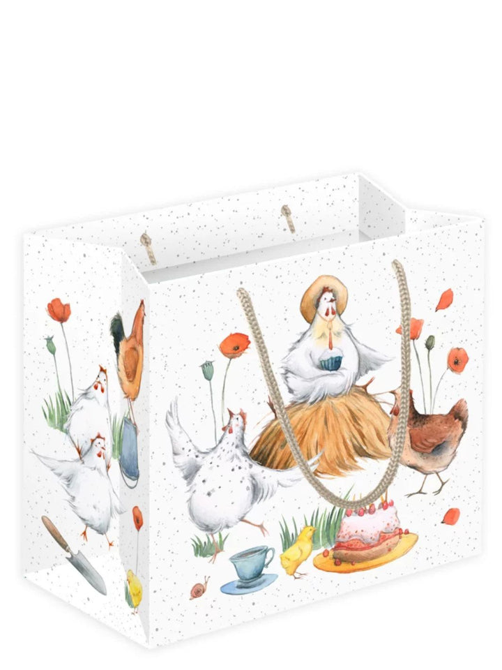 Geschenktasche „Hühnerbande“ vom Grätz Verlag mit bunten Hühnerillustrationen, Hühnern, Küken und Gartenszenen auf hellem, gepunktetem Hintergrund, seitliche Ansicht.