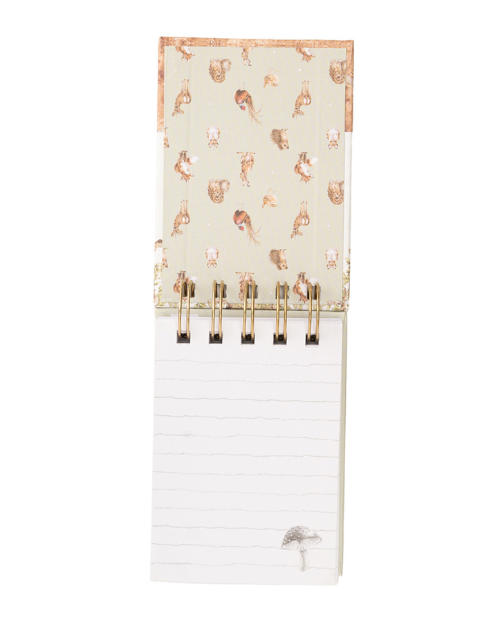 Aufgeschlagenes Mini Notiz- und Skizzenbuch „Woodland“ mit linierten Seiten und Spiralbindung.