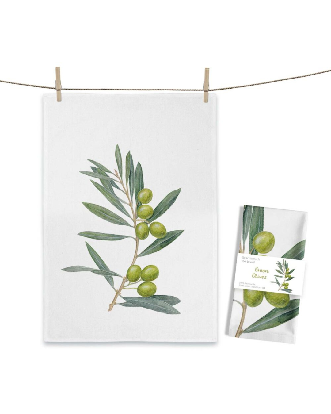 Oliven Geschirrtuch Green Olives von Maluu mit illustriertem Olivenzweig auf hellem Baumwollstoff aufgehängt an Leine