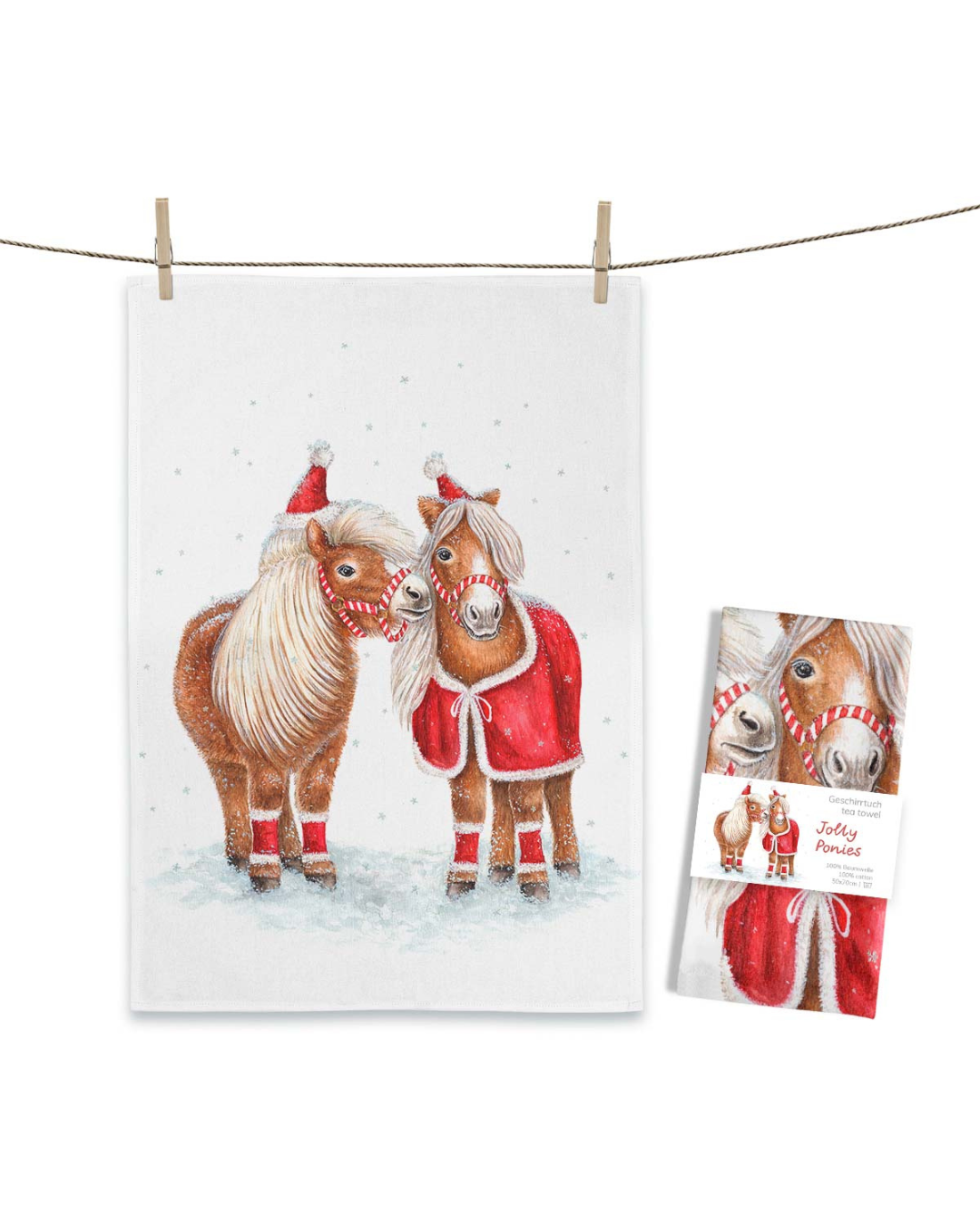 Pferde Geschirrtuch Jolly Ponies von Maluu mit Verpackung, winterliches Motiv mit zwei Ponys auf weißem Baumwolltuch.