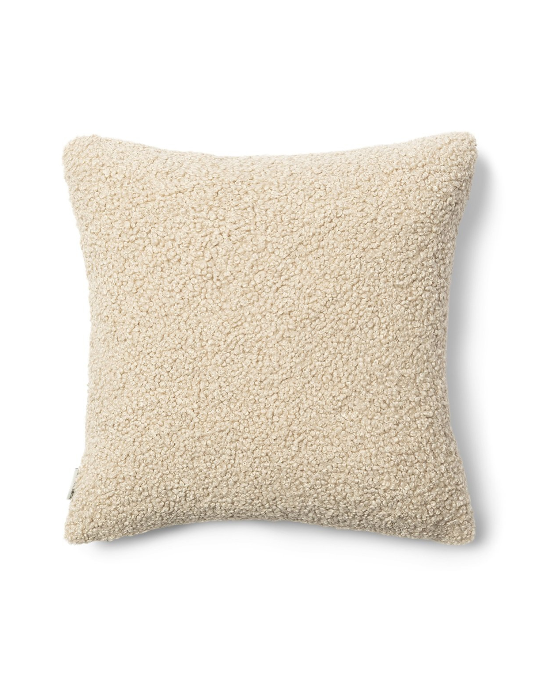 Rückseite des cremefarbenen Teddystoff-Kissenbezugs ohne Motiv.