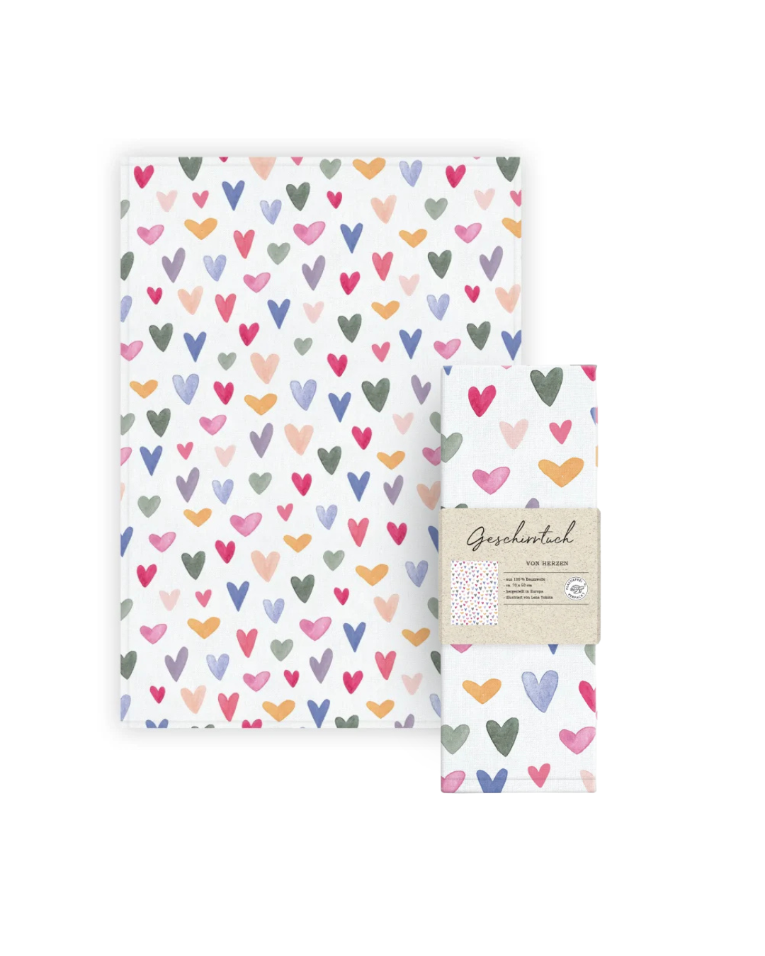 Geschirrtuch „Von Herzen“ vom Grätz Verlag neben der Verpackung, Herzmuster in verschiedenen Farben gut erkennbar, auf hellem Hintergrund arrangiert.